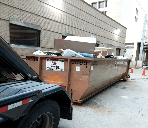 Gainsborough Waste roll-off dumpster outside of a place of business